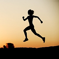 A silhouette of a woman running