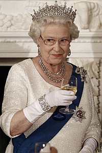Queen Elizabeth II sips on a glass of wine.