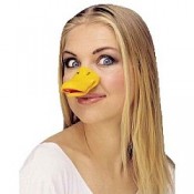 A pretty girl is wearing a duck's beak, making her ugly.